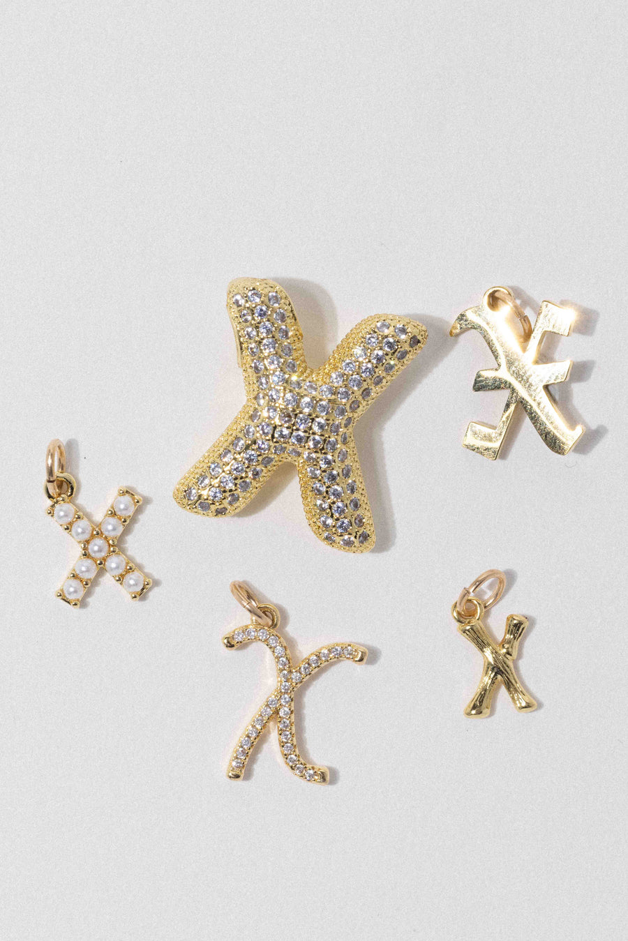 Child of Wild X Letter Charm - Old English